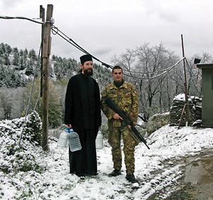 The needed security: right across the bridge is the mineral spring of Dečani, but armed escort is necessary